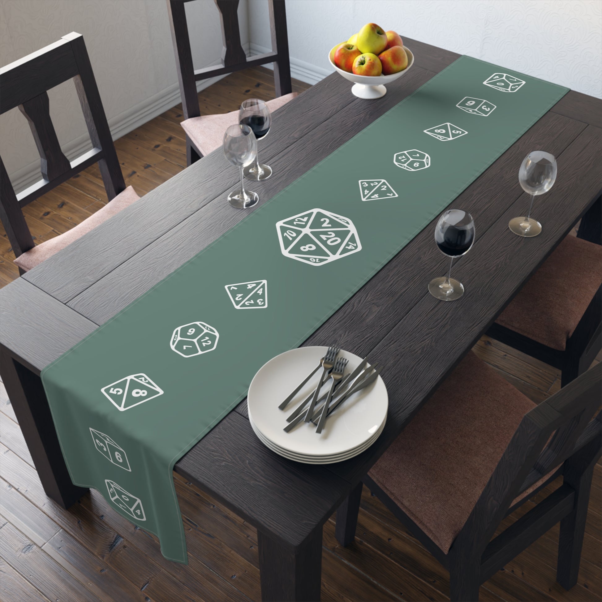 Green table runner with dice designs on a dining table